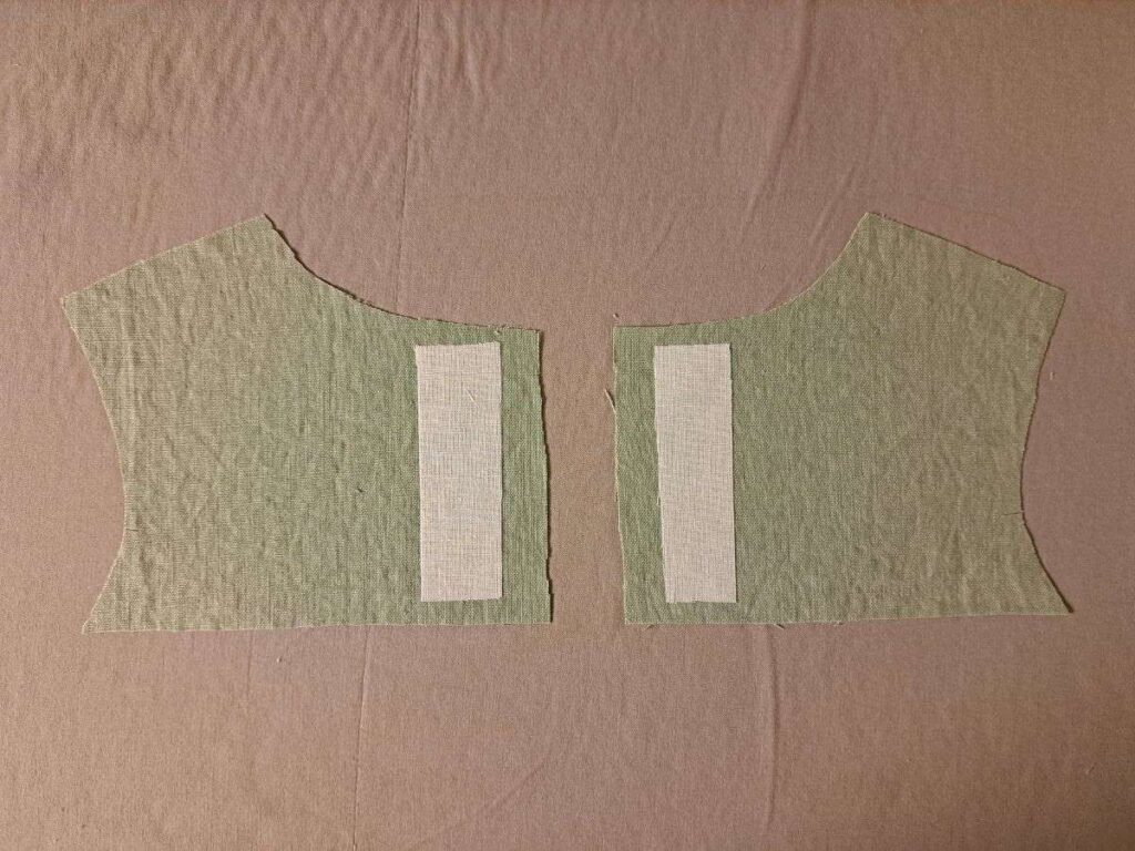 two back bodice pieces with interfacing ironed on