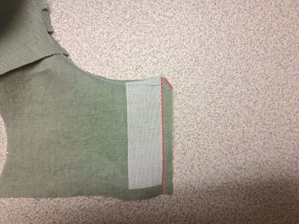 picture of wrong side of bodice showing where to stitch and clip along placket