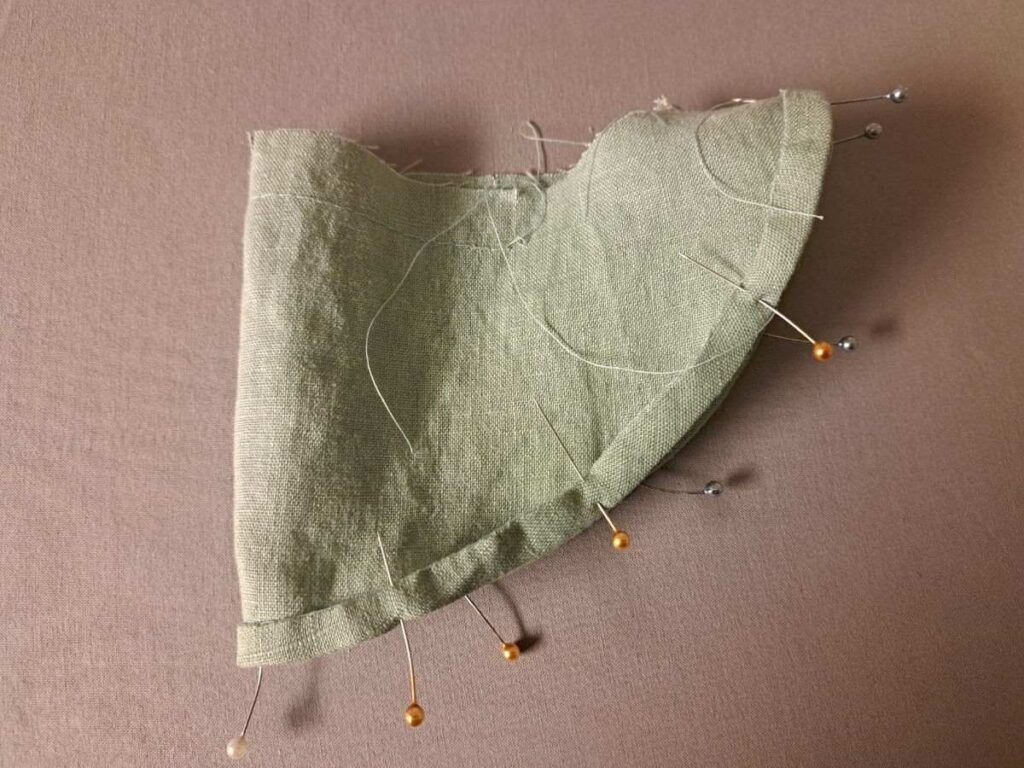 sleeve with hem folded, ironed, and pinned